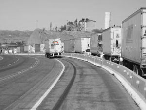 Integrated transportation truck passing other trucks